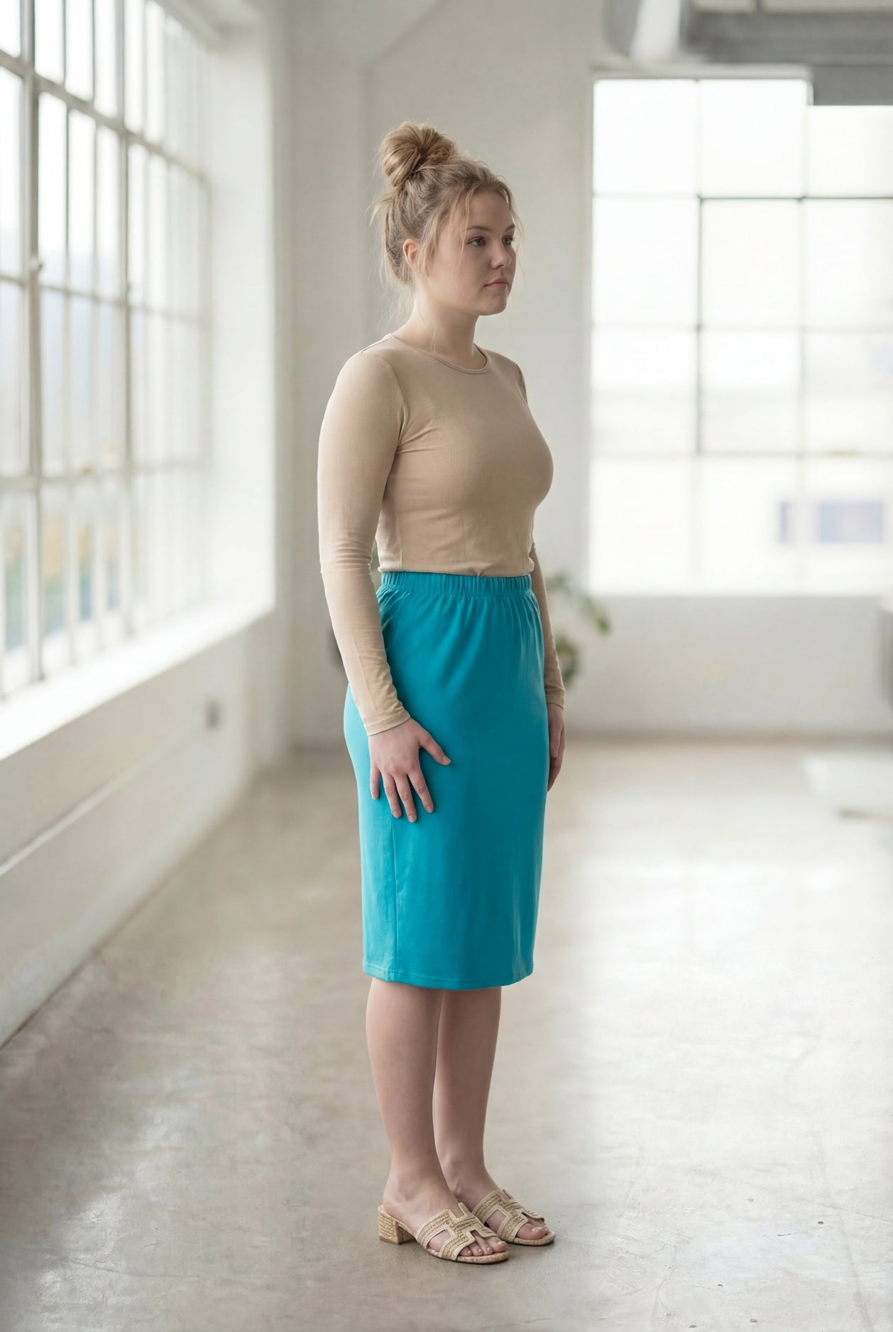 Model wearing Nuggles® 27" Classic Skirt in Teal
