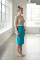 Model wearing Nuggles® 27" Classic Skirt in Teal