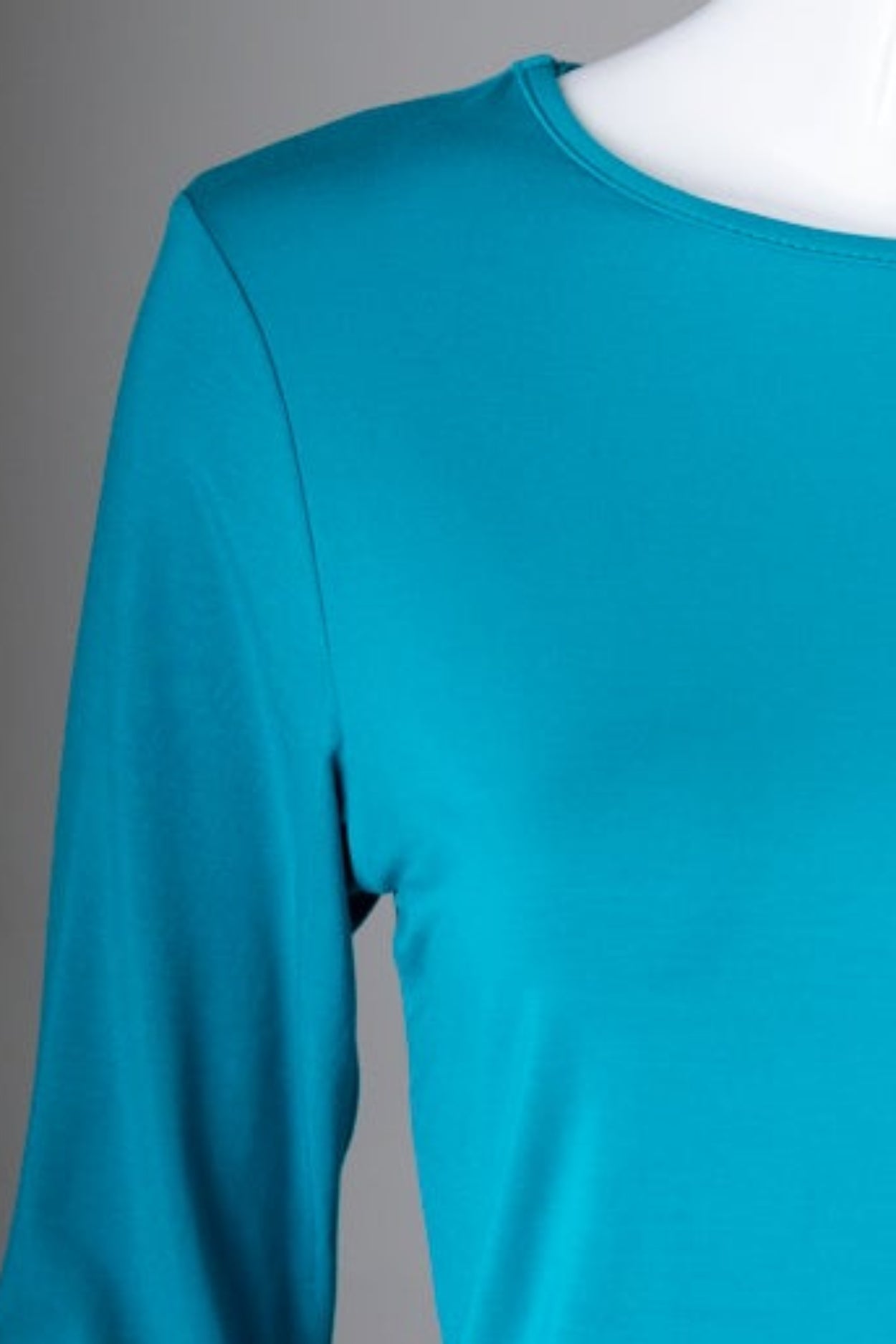 Model wearing Nuggles® 3/4 Essential Tee in Teal