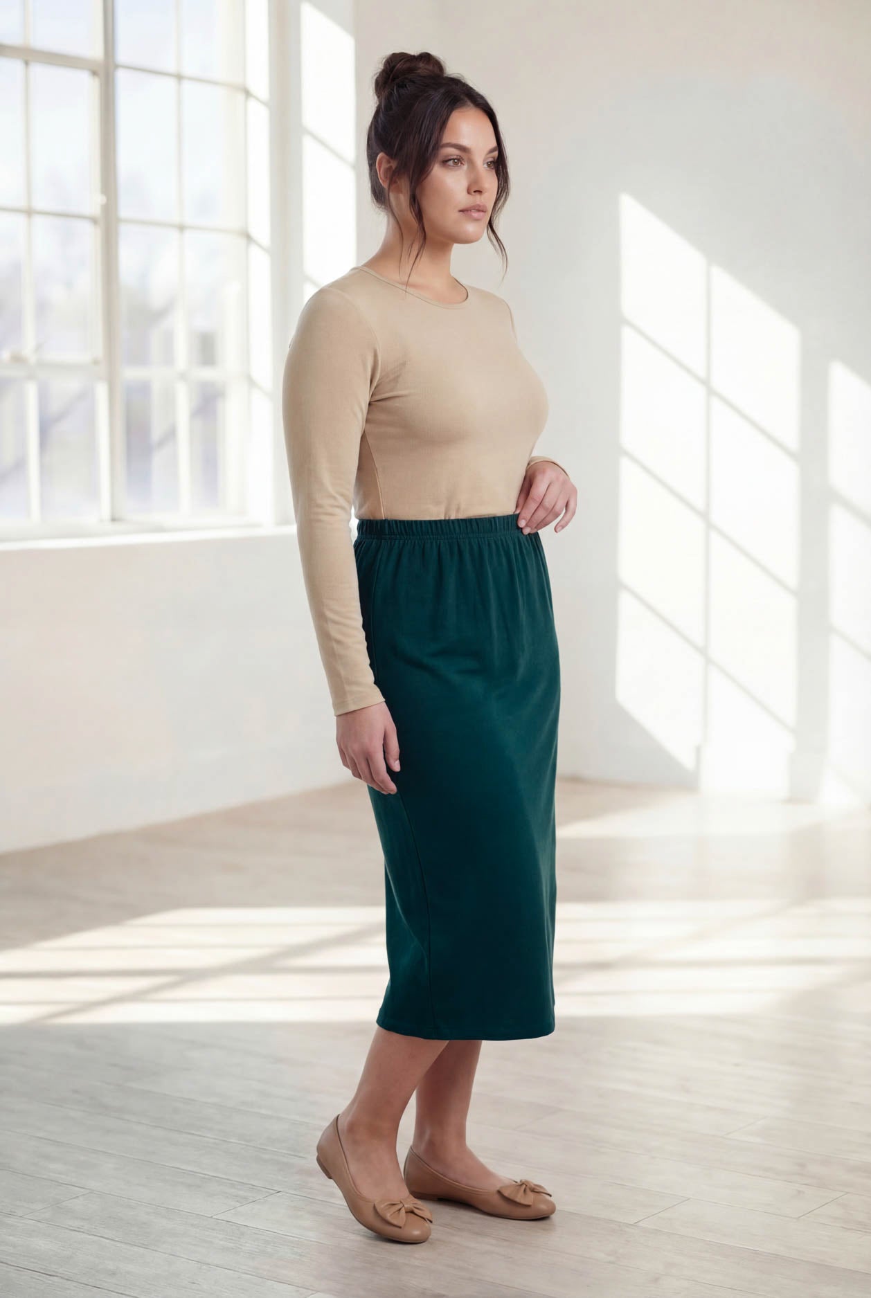 Model wearing Nuggles® 31" Classic Skirt  in Teal Green