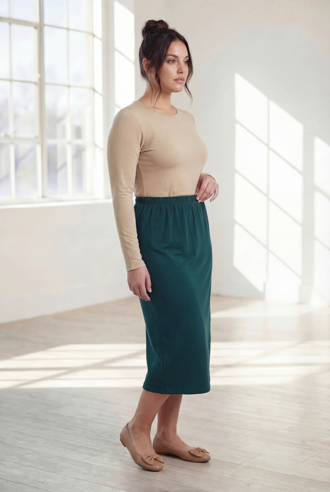 Model wearing Nuggles® 31" Classic Skirt  in Teal Green
