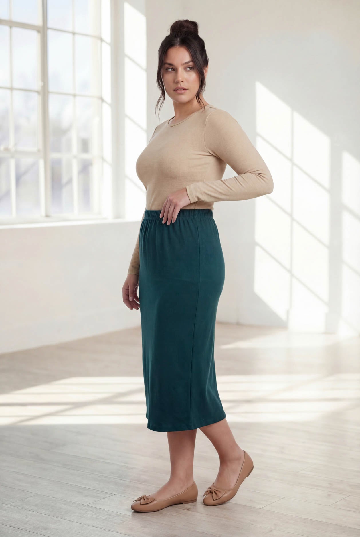 Model wearing Nuggles® 31" Classic Skirt  in Teal Green