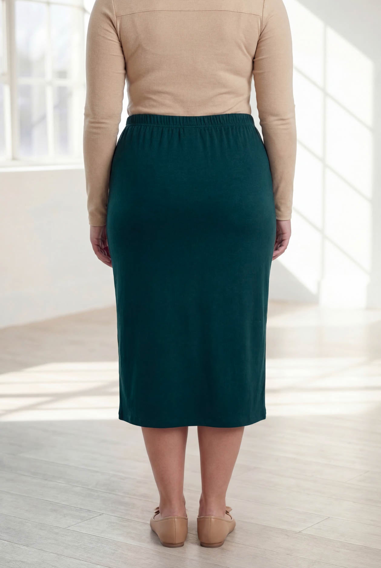Model wearing Nuggles® 31" Classic Skirt  in Teal Green