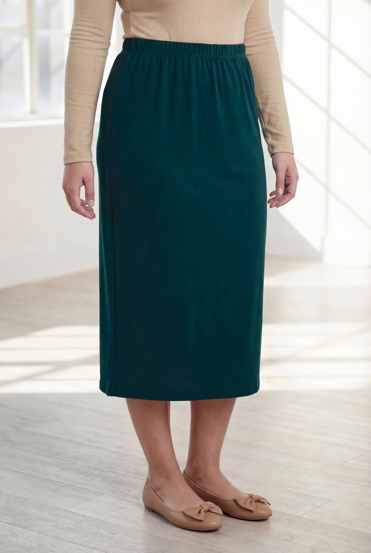 Model wearing Nuggles® 31" Classic Skirt  in Teal Green