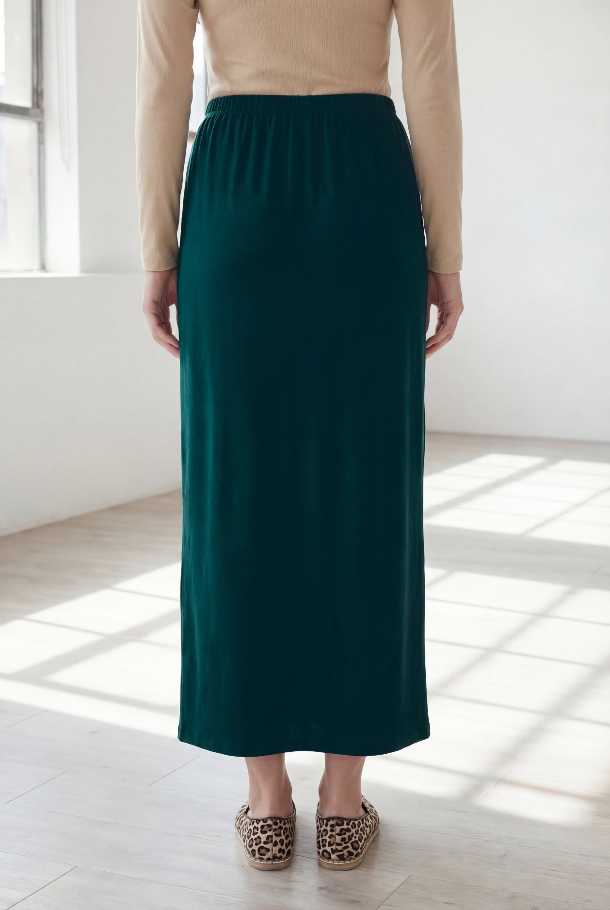 Model wearing Nuggles® 36" Classic Skirt  in Teal Green