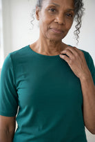 Model wearing Nuggles®  Half Sleeve Essential Tee in Teal Green