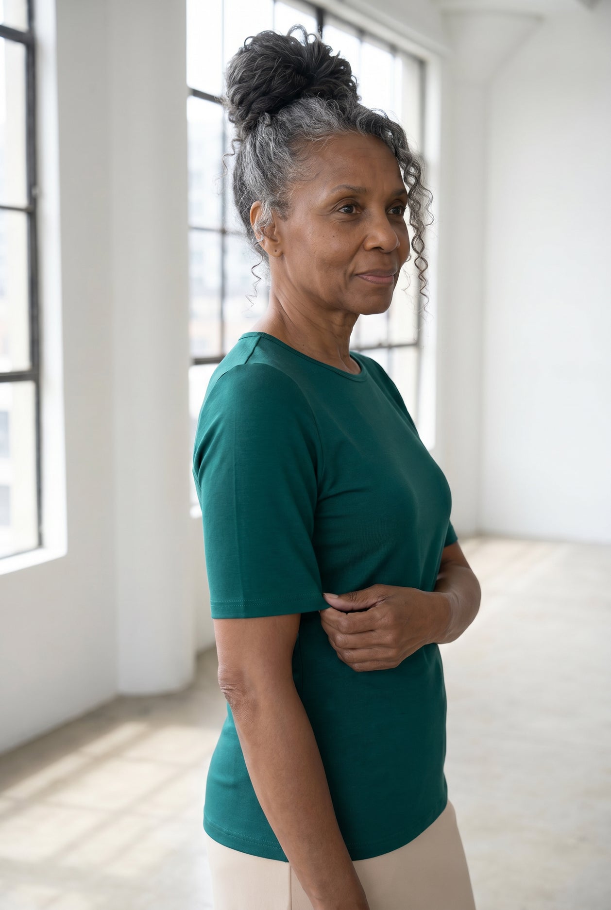 Model wearing Nuggles®  Half Sleeve Essential Tee in Teal Green