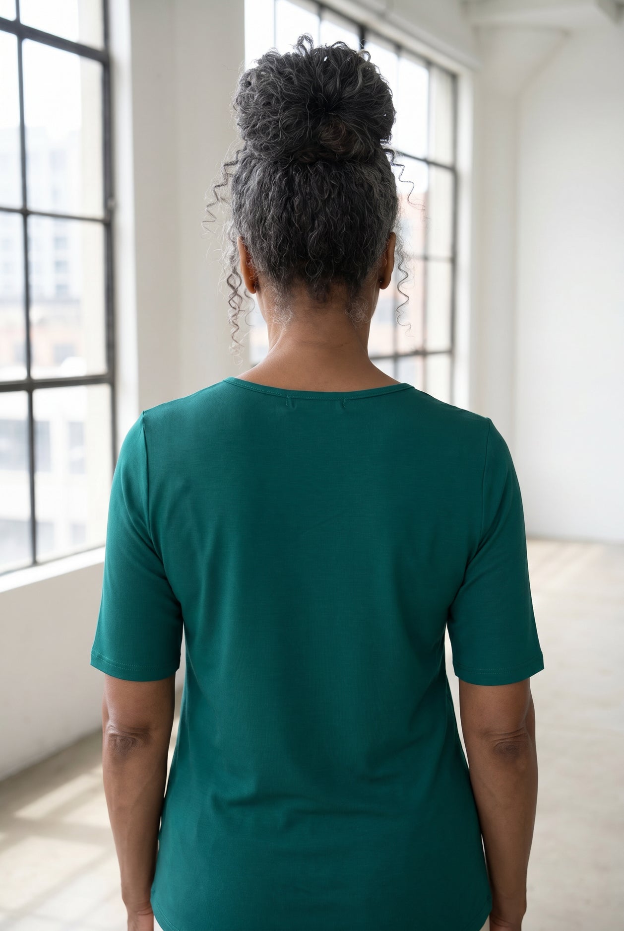Model wearing Nuggles®  Half Sleeve Essential Tee in Teal Green