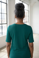 Model wearing Nuggles®  Half Sleeve Essential Tee in Teal Green