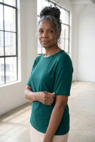Model wearing Nuggles®  Half Sleeve Essential Tee in Teal Green