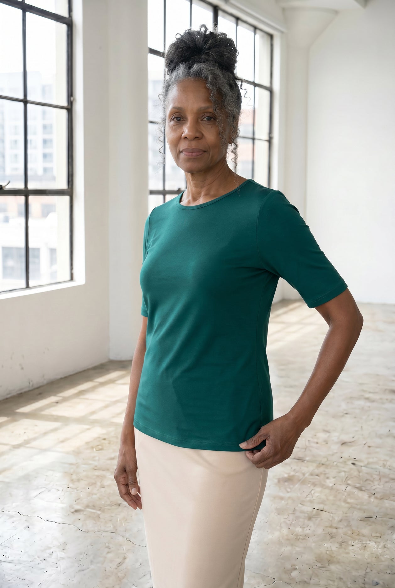 Model wearing Nuggles®  Half Sleeve Essential Tee in Teal Green