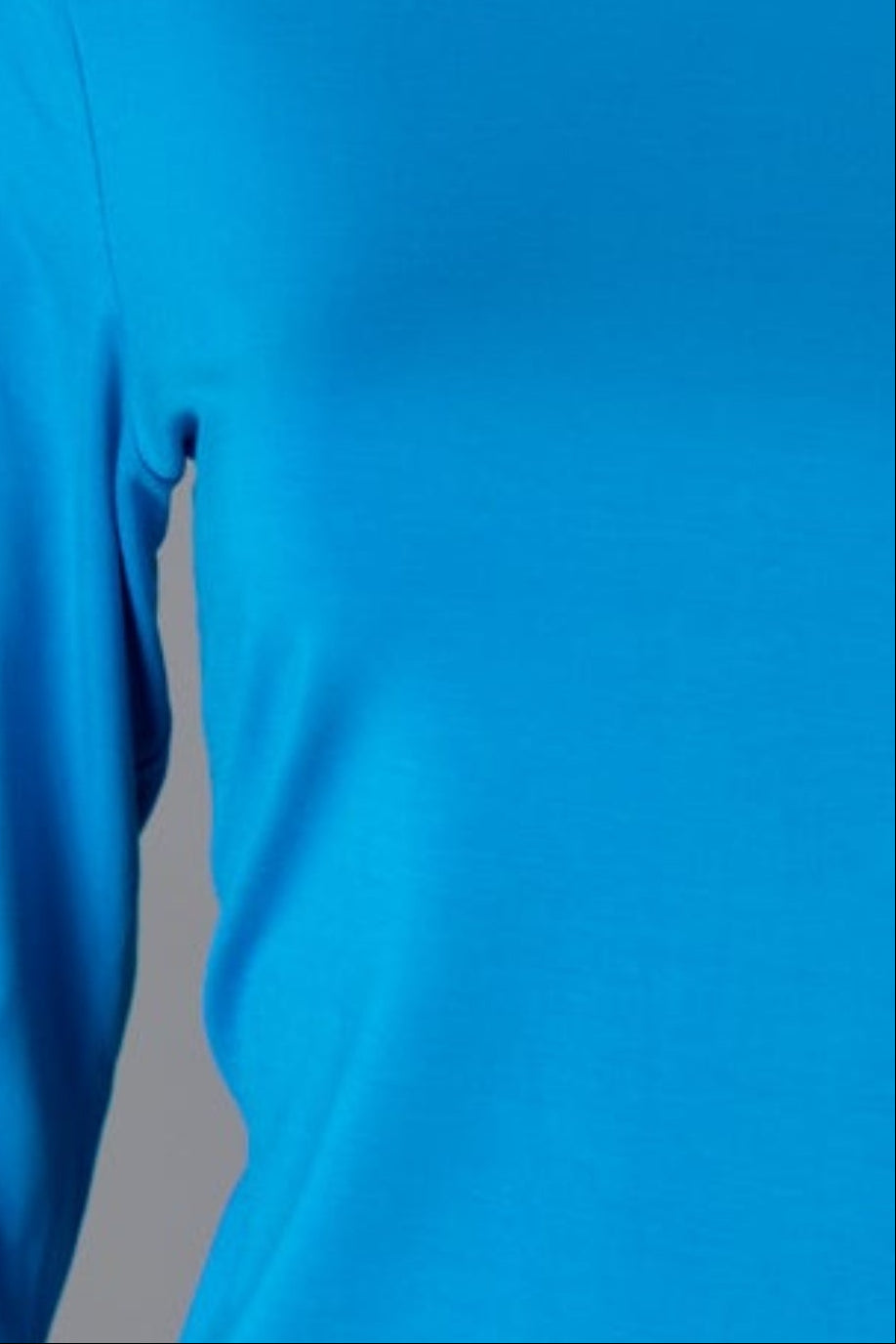 Model wearing Nuggles® 3/4 Essential Tee in Turquoise