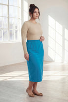 Model wearing Nuggles® 31" Classic Skirt  in Turquoise