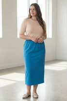Model wearing Nuggles® 34" Classic Skirt  in Turquoise