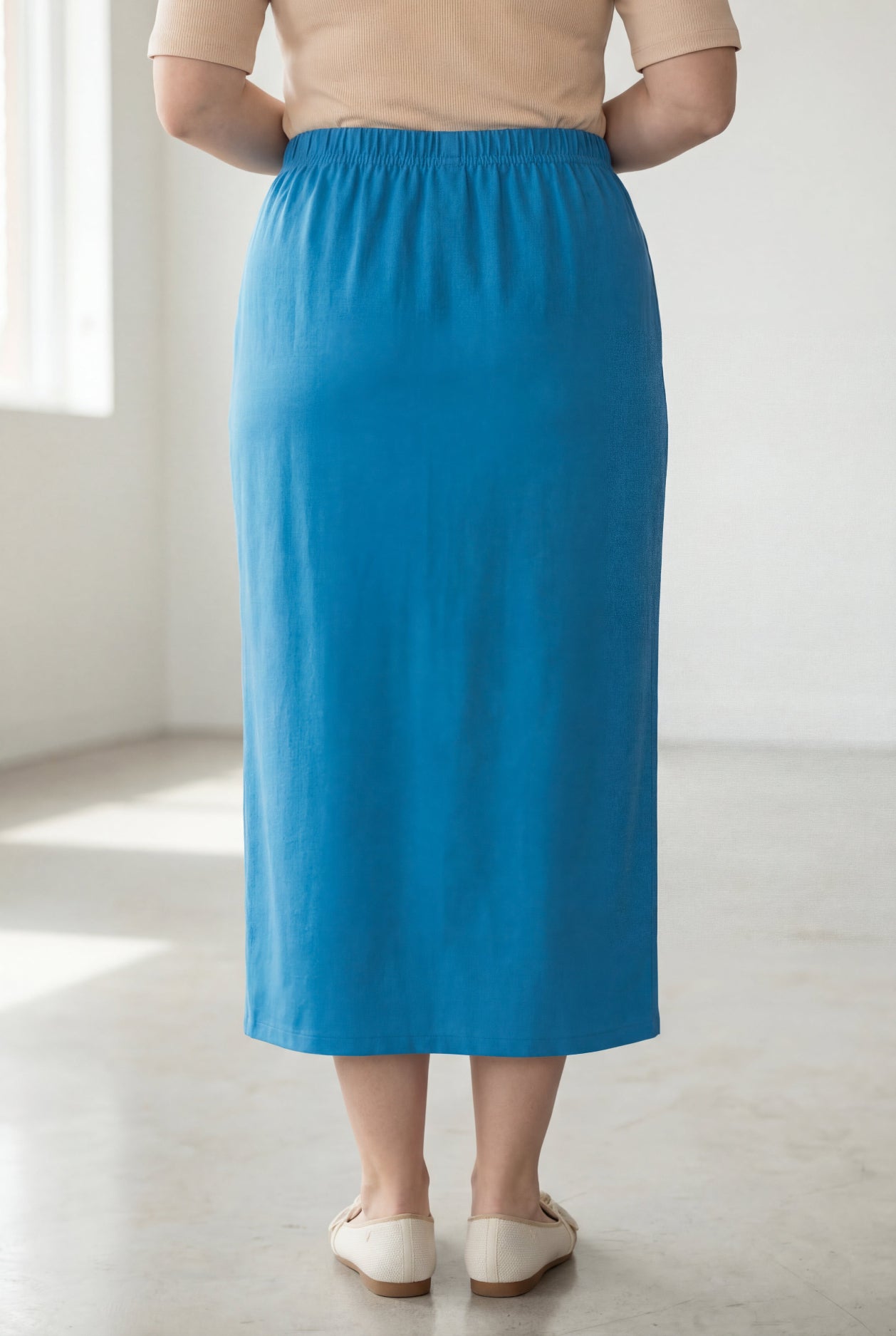 Model wearing Nuggles® 34" Classic Skirt  in Turquoise