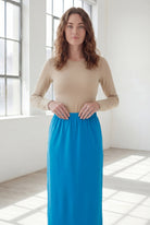 Model wearing Nuggles® 36" Classic Skirt  in Turquoise
