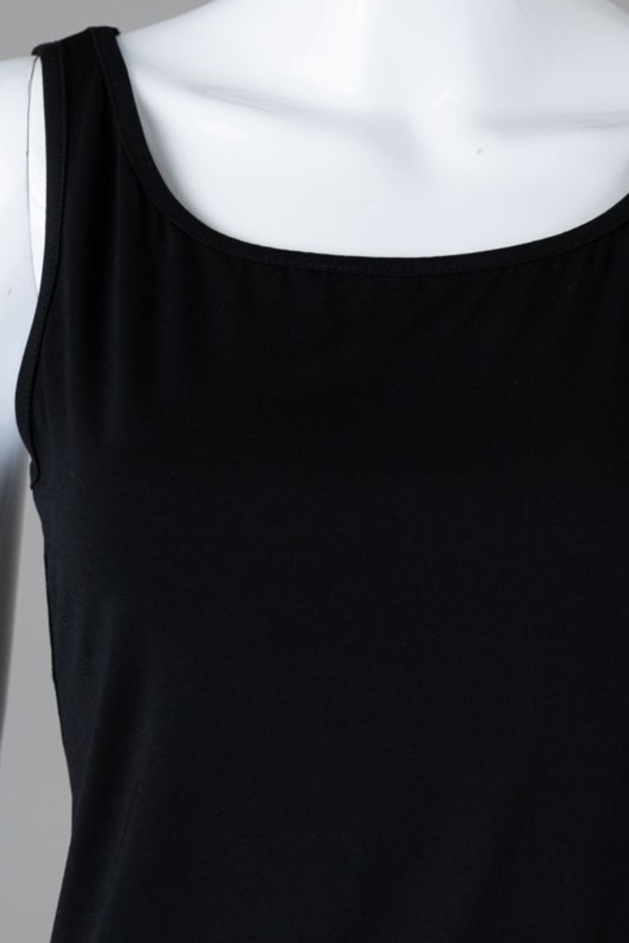 Model wearing Nuggles® Wide Neck Tank in Black