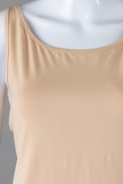 Model wearing Nuggles® Wide Neck Tank in Buff