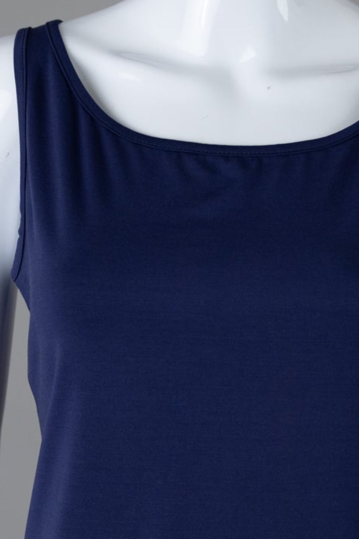 Model wearing Nuggles® Wide Neck Tank in Navy
