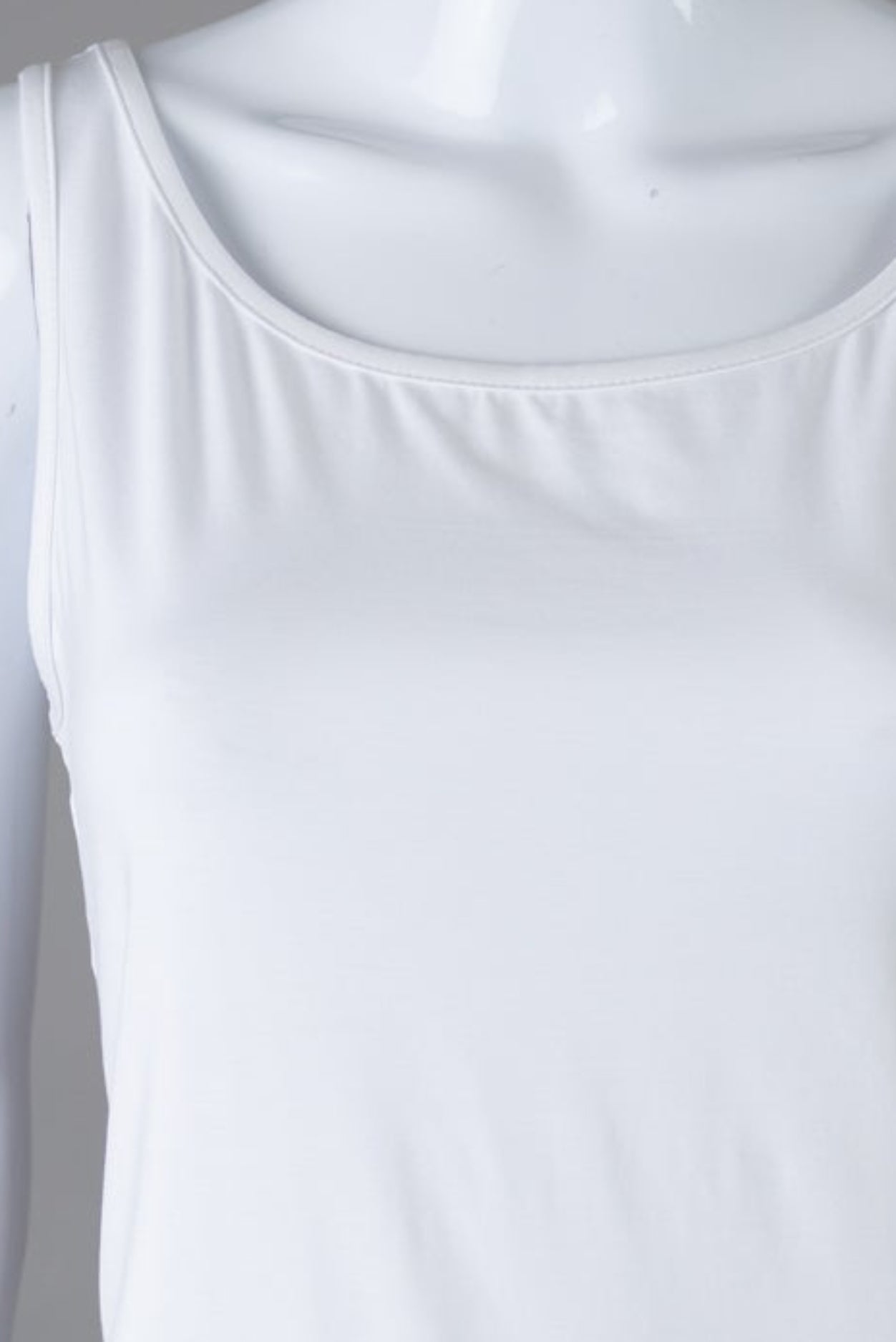 Model wearing Nuggles® Wide Neck Tank in White