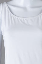 Model wearing Nuggles® Wide Neck Tank in White